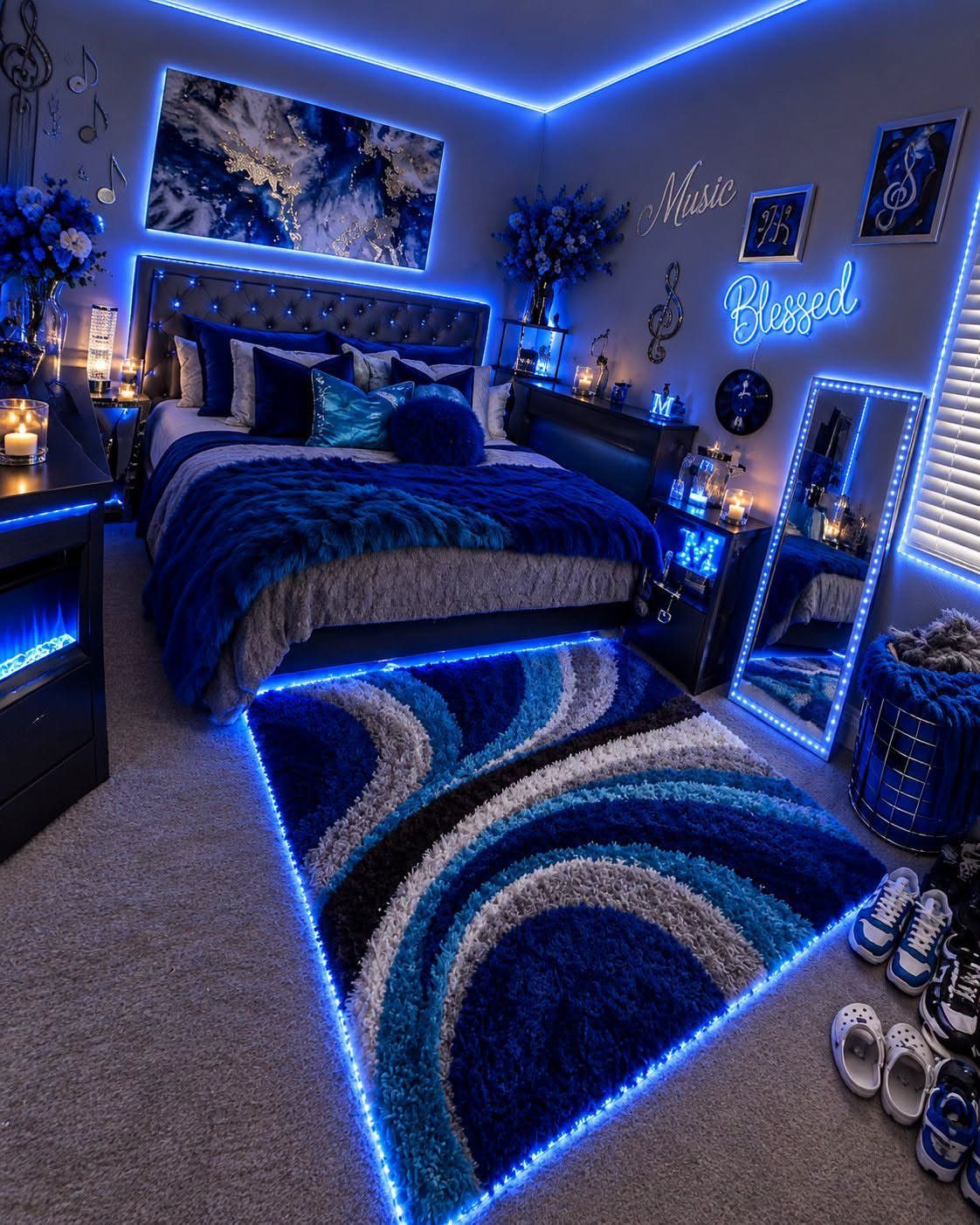 Blue and grey themed bedroom with matching LED lighting, rug, and bedding.